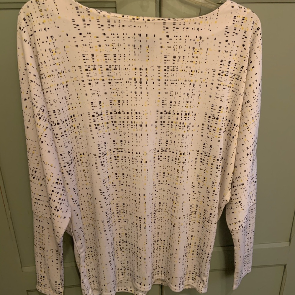 Stylish white top with black and gold design!